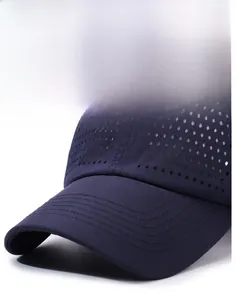 Detail of laser-cut breathable holes and quick-dry fabric on navy blue baseball cap