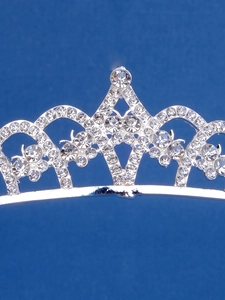 Close-up of sparkling rhinestones and intricate silver crown headband craftsmanship