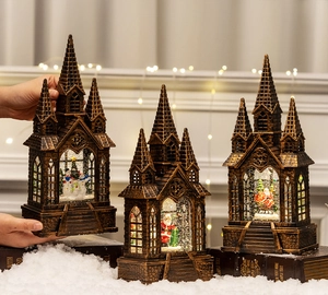 Group display of bronze vintage Christmas church lanterns with warm LED lighting and snow