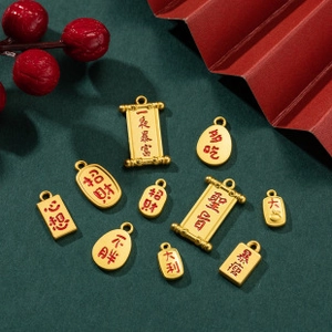 Macro shot of gold medical charms with Chinese calligraphy on a green background