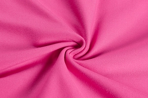 Detail of soft high-elastic knit fabric with smooth texture in vibrant magenta color