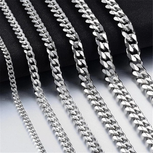 Detail view of silver Cuban link chains in various widths with polished steel finish