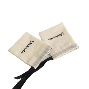 Minimalist beige linen cotton jewelry drawstring bags with black silk ribbon handles