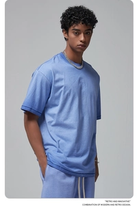 Macro detail of light blue washed cotton street wear t-shirt and shorts set texture