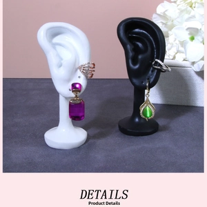 Detail of purple and green gemstone earring sets on silicone ear display models