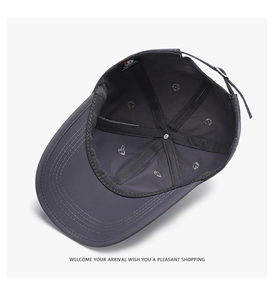 Detailed interior of dark gray baseball cap showing inner seams and adjustable strap