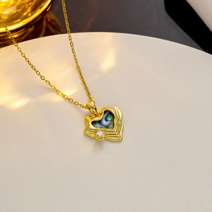 Golden shell heart pendant necklace with abalone shell and zircon on a gold chain