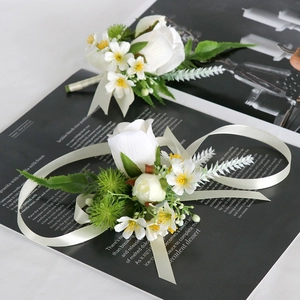 Elegant white rose groom boutonniere and bridal wrist corsage set for forest weddings