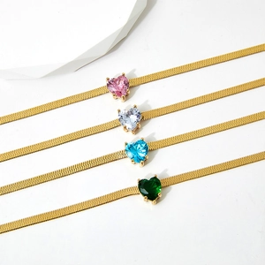 Flat gold snake chain necklace with vibrant heart-shaped emerald and zircon pendants