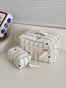 Quilted makeup bag set with blue stripes and pink hearts on creamy white fabric