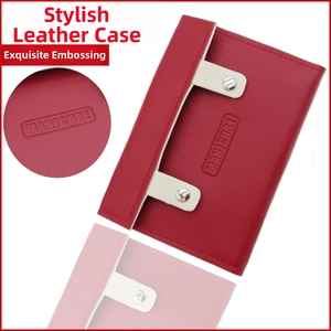 Detail of red leather manicure kit case with white strap and embossed text