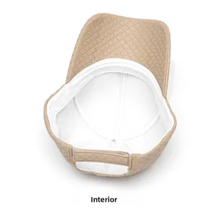 Detail view of khaki PU leather baseball cap with quilted diamond pattern and internal lining