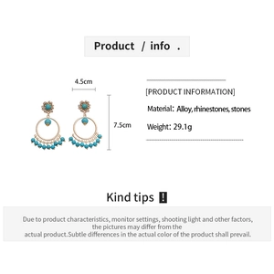 Detail view showing bohemian round fringe earrings with turquoise beads and rhinestones