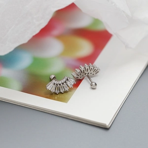 Macro view of S925 silver fan-shaped piercing stud with zircon and screw ball back