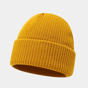 Minimalist mustard yellow ribbed knit beanie hat for winter with a wide folded cuff design