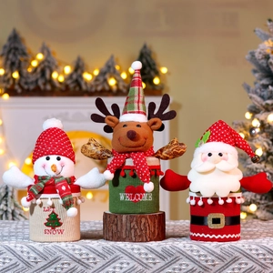 Set of 3 knitted Christmas gift jars with Santa, Reindeer and Snowman on wooden stumps