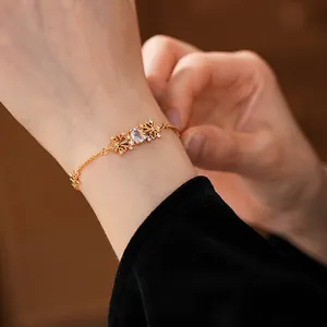Gold hollow iris zircon bracelet for women with elegant adjustable link chain design
