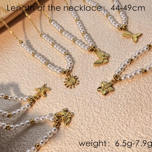 Elegant gold pearl necklaces with diverse charms like sun, butterfly, and starfish