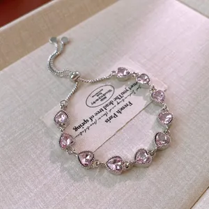 Elegant adjustable pink heart zircon bracelet in a minimalist silver setting style