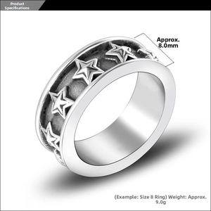 Macro shot of 8mm wide vintage titanium steel star ring showing engraved pentagram details