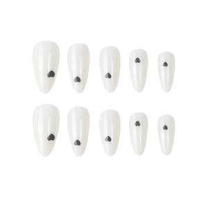 Almond shaped white press-on nails featuring minimalist black heart patterns for women