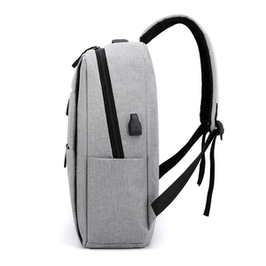 Gray modern business laptop backpack with external USB charging port side view