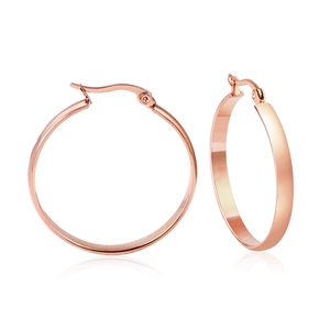 Detailed close-up of thick rose gold stainless steel hoop earrings on a clean white backdrop