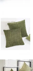 Close-up of olive green pleated textured cushion covers with hidden zipper detail
