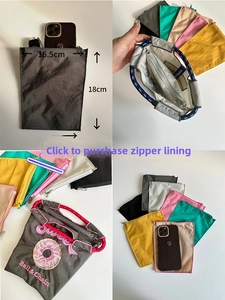 Detailed view of portable nylon organizer bag showing dimensions and interior zip pockets