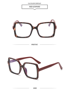 Detail view of square oversized frames in red leopard pattern with blue light lenses