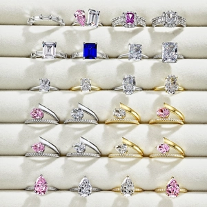 Detailed array of multi-colored oval and pear-cut zircon rings in silver and gold settings