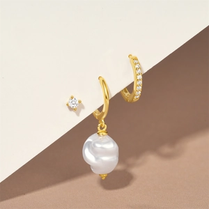 Detail of 3-piece set featuring pearl drop earring and gold hoop with micro-pave zircons