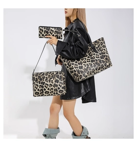 Three-piece leopard print bag set including tote, shoulder bag, and clutch wallet