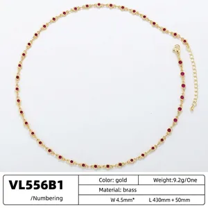 Elegant gold brass necklace with red round cubic zirconia gems and adjustable link chain