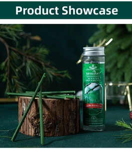 Close-up of green scented sticks for Christmas trees on wood with pine needles deco