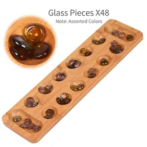 Close-up of natural wood Mancala board with 48 translucent brown glass stone pieces