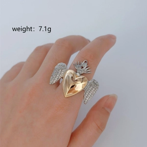 Gothic heart wing adjustable ring in gold and silver finish, weighing 7.1g