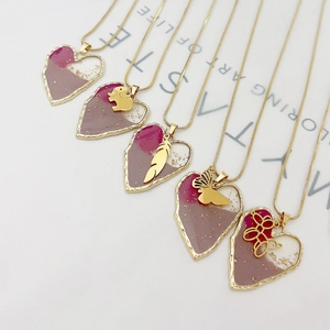 Retro snake chain necklace featuring vintage pink heart resin pendants with gold charms