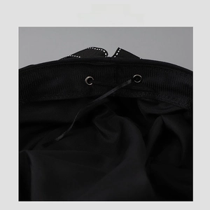 Detailed interior view of a black JK beret with adjustable drawstring and white stitching