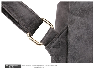 Detail of light gold square metal hardware and reinforced stitching on a grey backpack