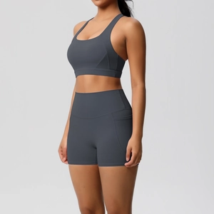 Detailed view of dark grey yoga shorts with side pocket for phone and high waistband