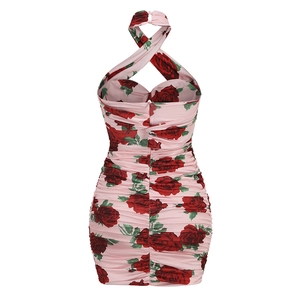 Detail of ruched back and halter neck straps on pink rose print slim fit dress