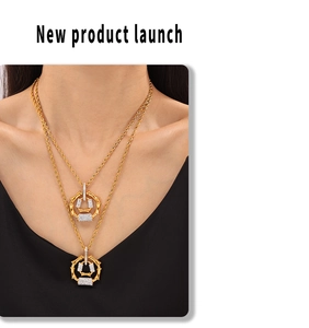Close-up of golden bamboo joint necklace with micro-pave diamonds on twisted chain
