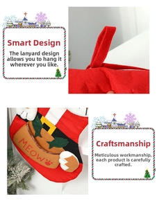 Detail of red Christmas stocking with hanging loop and cute cat-themed embroidery