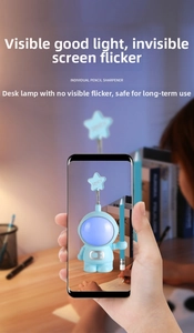 Smartphone screen showing no-flicker blue astronaut LED lamp and pencil sharpener