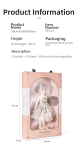 Detail view of 30cm fashion doll in a pink window box with 13 joints and 3D eyes