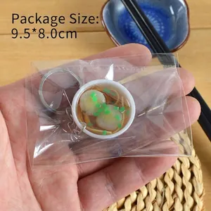 Miniature blue and white porcelain noodle bowl keychain with 9.5x8.0cm packaging size