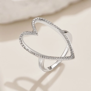 Close-up of S925 sterling silver hollow heart ring with sparkling zircon inlay