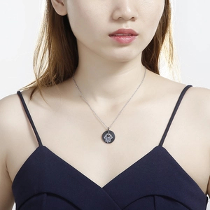 Minimalist silver Hamsa Hand pendant necklace with crystals on model for elegant style