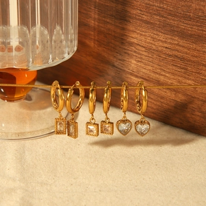 Three pairs of 18k gold plated stainless steel earrings with heart and square zircon charms
